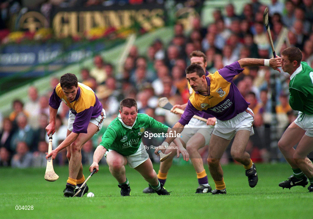 1 September 1996; Adrian Fenlon of Wexford, left, supported by team-mate, Martin Storey, in action against Mike Houlihan, second from left, and Ciaran Carey of Limerick during the GAA All-Ireland Senior Hurling Championship Final match between Wexford and Limerick Croke Park in Dublin. Photo by Ray McManus/Sportsfile