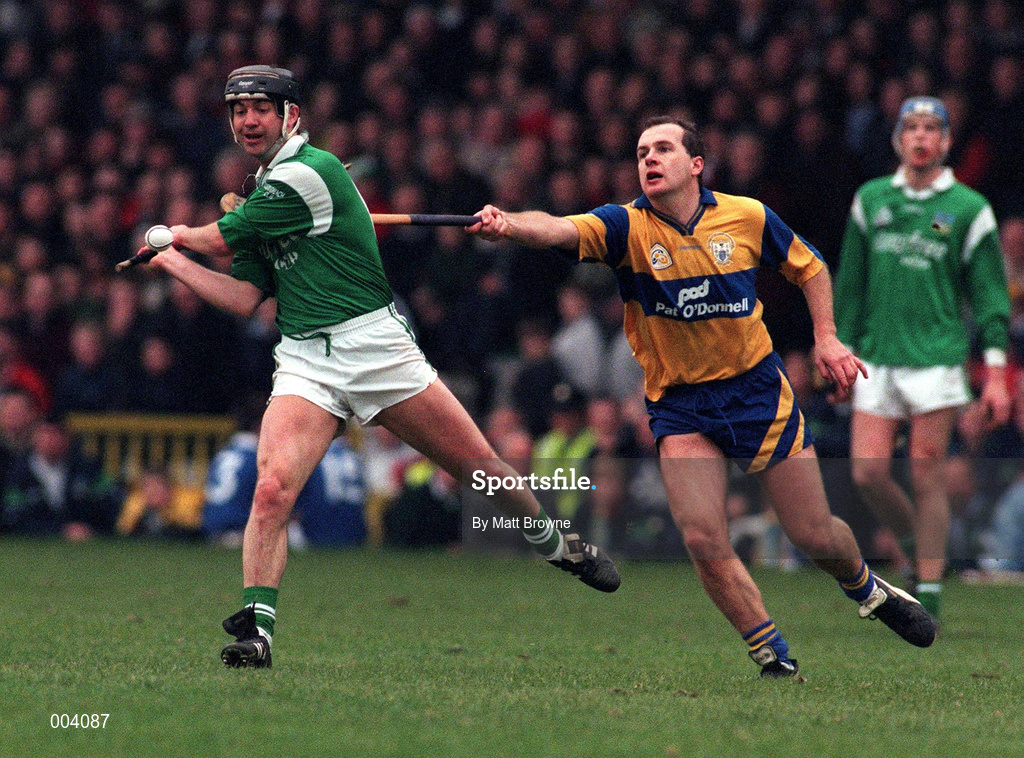 22 March 1998; Mike Galligan of Limerick in action against Liam Doyle of Clare during the Church & General National Hurling League Division 1A match between Limerick and Clare at the Gaelic Grounds in Limerick. Photo by Matt Browne/Sportsfile