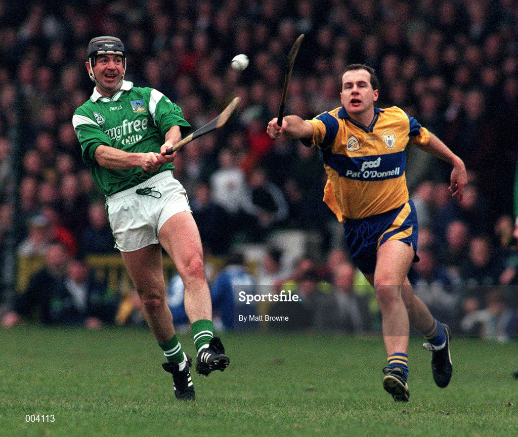22 March 1998; Mike Galligan of Limerick in action against Liam Doyle of Clare during the Church & General National Hurling League Division 1A match between Limerick and Clare at the Gaelic Grounds in Limerick. Photo by Matt Browne/Sportsfile