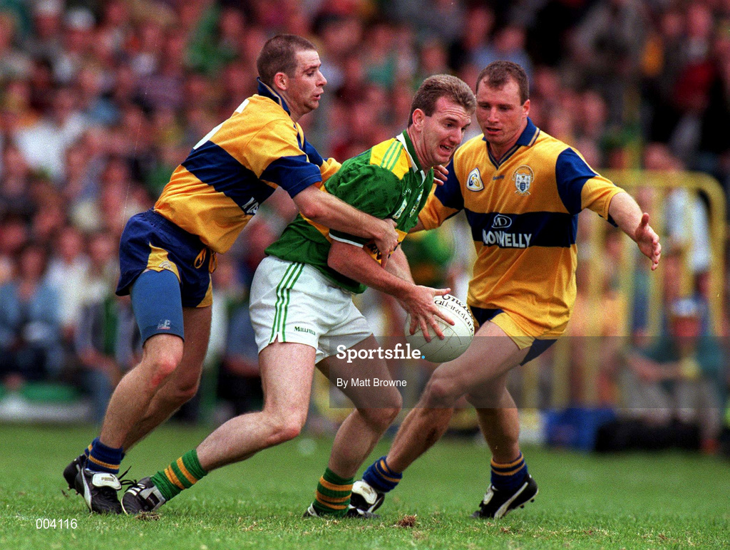 20 July 1997; Mike Hassett of Kerry in action against Barry Keating, left and Martin Daly of Clare during the GAA Munster Senior Football Championship Final match between Kerry and Clare at Gaelic Grounds in Limerick. Photo by Matt Browne/Sportsfile