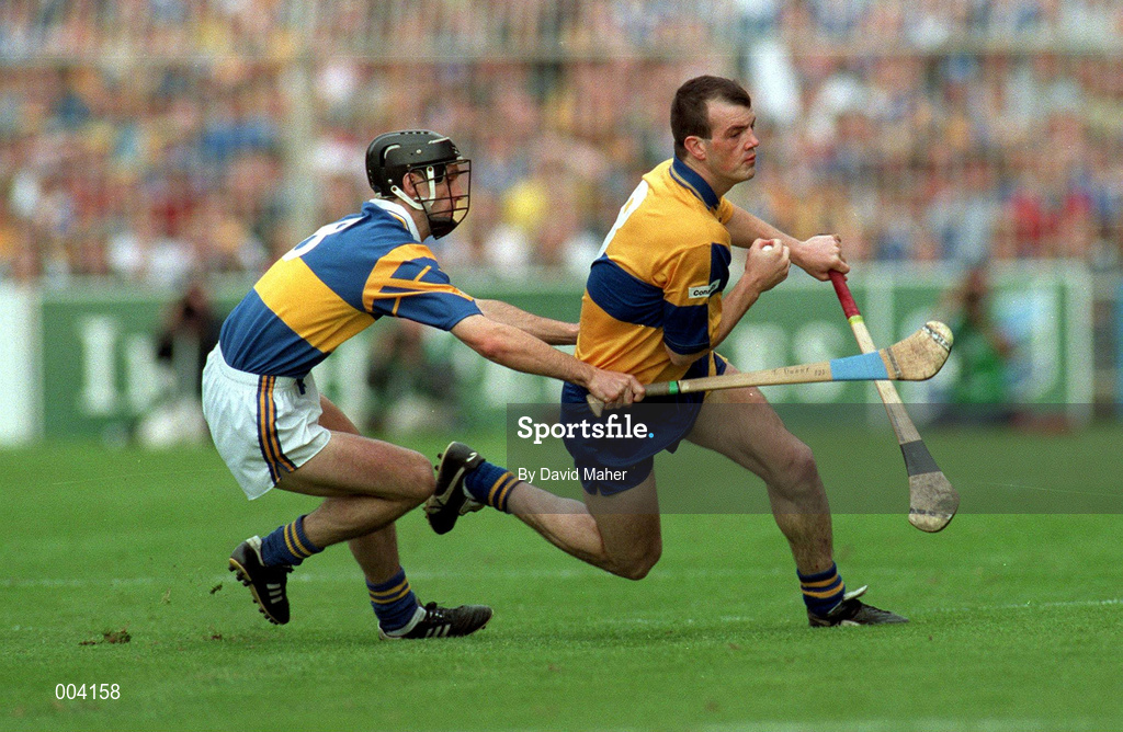 14 September 1997; Ollie Baker of Clare in action against Tommy Dunne of Tipperary during the Guinness All-Ireland Senior Hurling Championship Final between Clare and Tipperary at Croke Park in Dublin. Photo by David Maher/Sportsfile