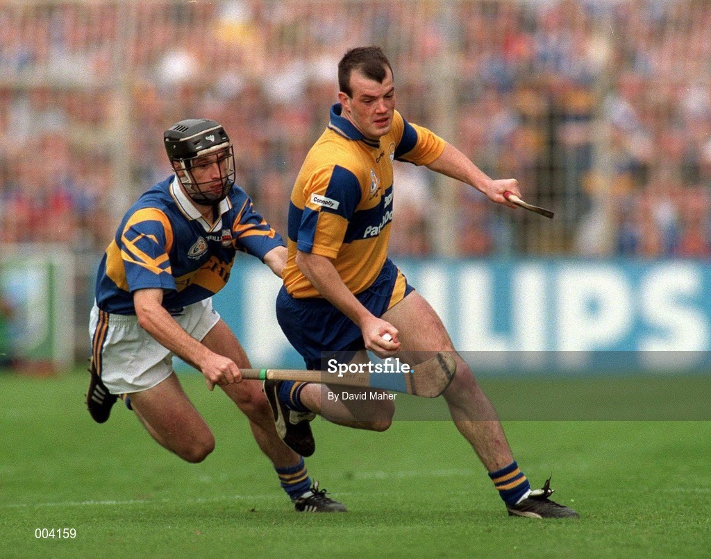 14 September 1997; Ollie Baker of Clare in action against Tommy Dunne of Tipperary during the Guinness All Ireland Hurling Final match between Clare and Tipperary at Croke Park in Dublin. Photo by David Maher/Sportsfile