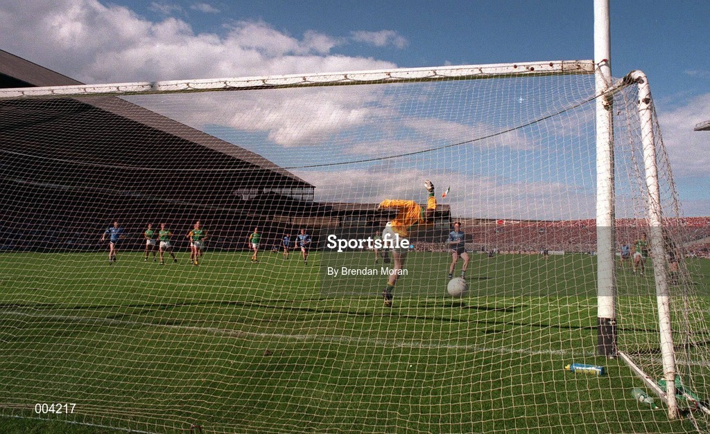 15 June 1997; Paul Bealin of Dublin blasts his penalty which was the last kick of the game, against the crossbar, as past Meath goalkeeper Conor Martin dives to save, during the GAA Senior Football Championship Quarter-Final match between Meath and Dublin at Croke Park in Dublin. Photo by Brendan Moran/Sportsfile