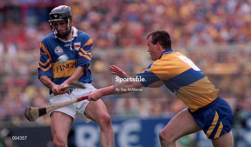 14 September 1997; Tommy Dunne of Tipperary in action against Ollie Baker of Clare during the Guinness All Ireland Hurling Final match between Clare and Tipperary at Croke Park in Dublin. Photo by Ray McManus/Sportsfile