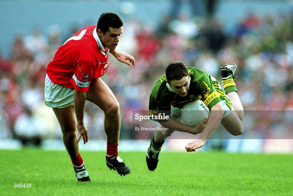 18 June 2000; Enda Galvin of Kerry is tackled by Martin Cronin of Cork during the Bank of Ireland Munster Senior Football Championship Semi-Final match between Kerry and Cork at Fitzgerald Stadium in Killarney, Kerry. Photo by Brendan Moran/Sportsfile