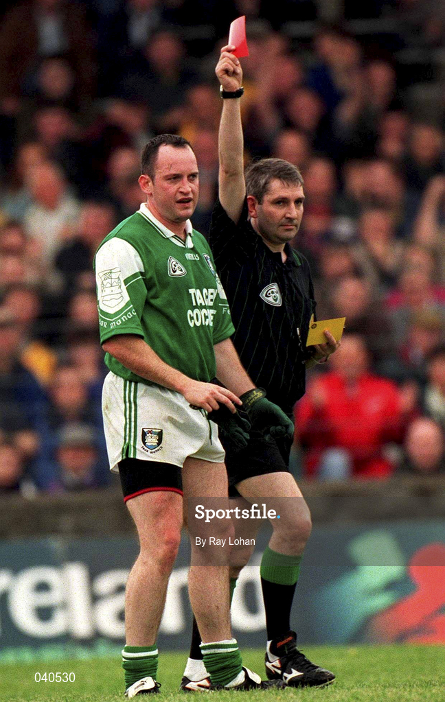 11 June 2000; Tony Collins of Fermanagh is shown a red card by referee Des Joyce during the Bank of Ireland Ulster Senior Football Championship Quarter-Final match between Donegal and Fermanagh at MacCumhaill Park in Ballybofey, Donegal. Photo by Ray Lohan/Sportsfile