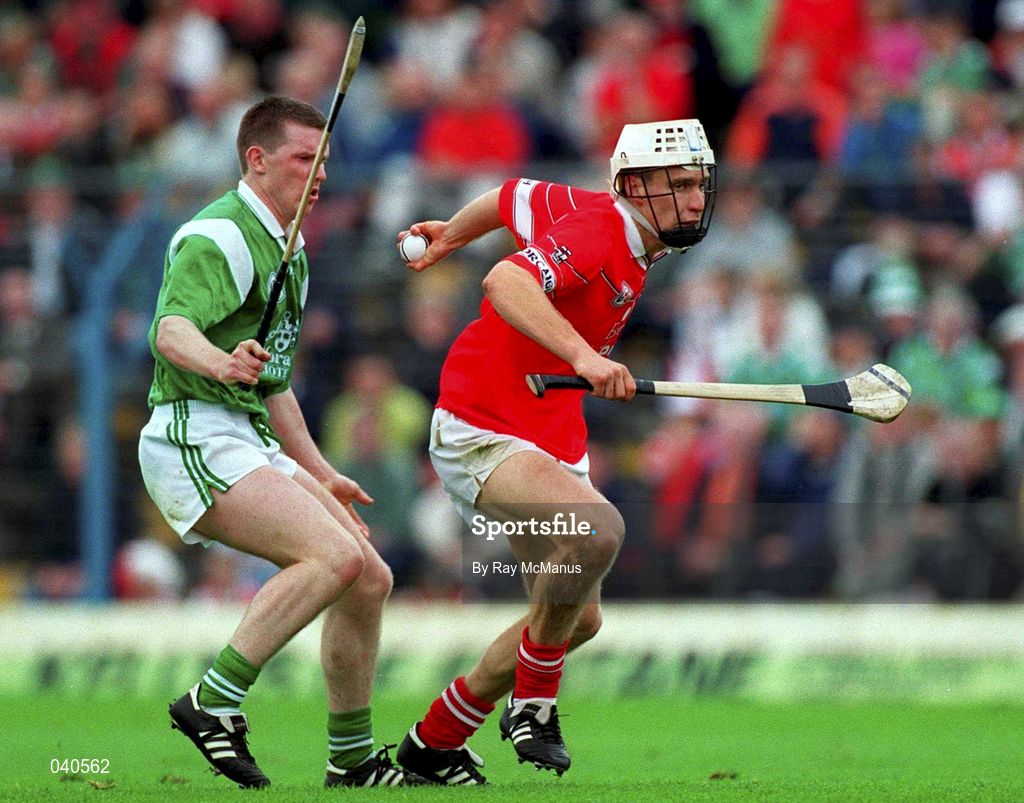 4 June 2000; Timmy McCarthy of Cork in action against Mark Foley of Limerick during the Guinness Munster Senior Hurling Championship Semi-Final between Cork and Limerick at Semple Stadium in Thurles, Tipperary. Photo by Ray McManus/Sportsfile