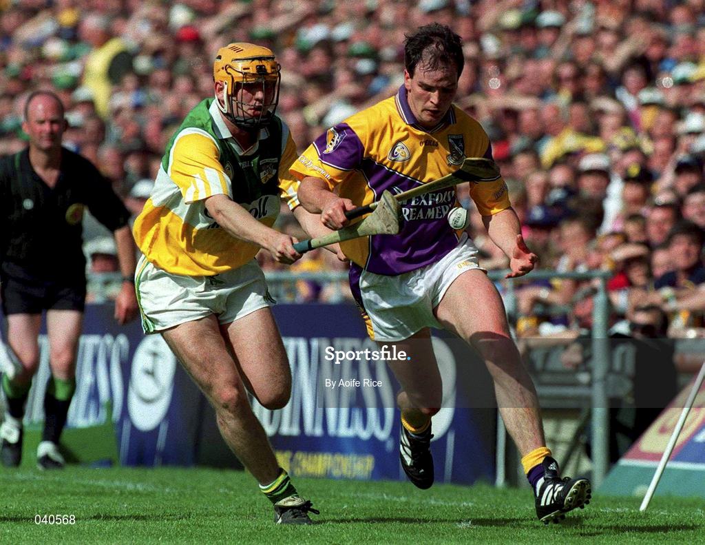 18 June 2000; Adrian Fenlon of Wexford in action against Paudie Mulhare of Offaly during the Guinness Leinster Senior Hurling Championship Semi-Final match between Offaly and Wexford at Croke Park in Dublin. Photo by Aoife Rice/Sportsfile
