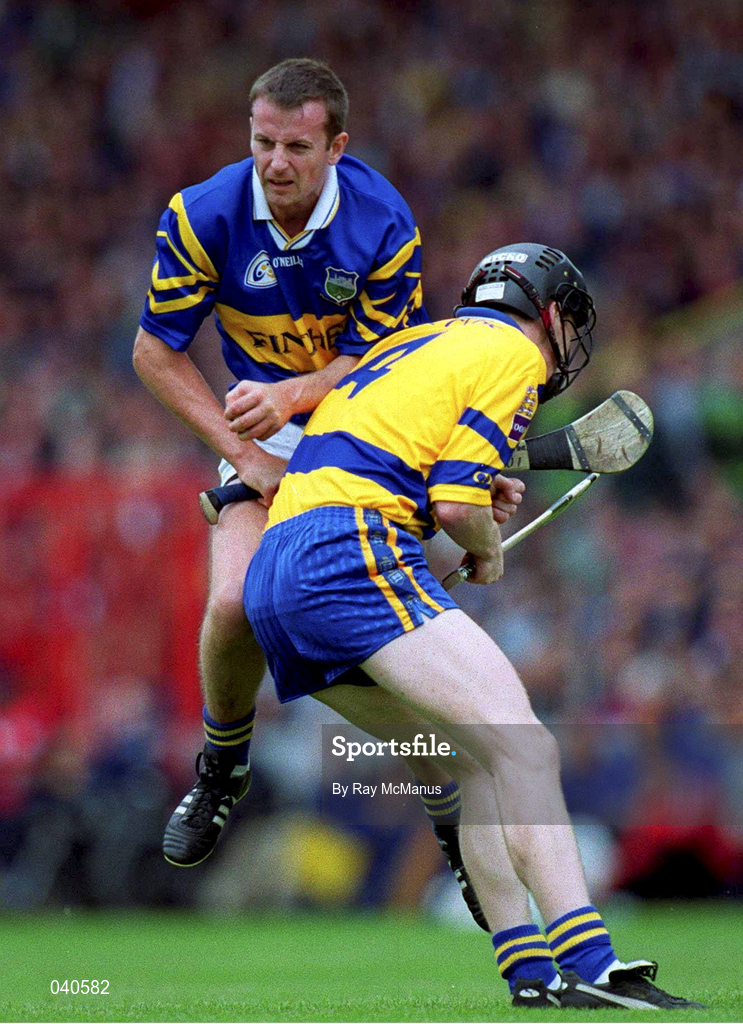 11 June 2000; Brian O'Meara of Tipperary in action against Frank Lohan of Clare during the Guinness Munster Senior Hurling Championship Semi-Final match between Tipperary and Clare at Páirc Ui Chaoimh in Cork. Photo by Ray McManus/Sportsfile