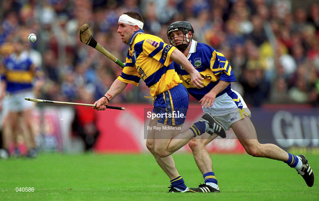 11 June 2000; Colin Lynch of Clare in action against Thomas Dunne of Tipperary during the Guinness Munster Senior Hurling Championship Semi-Final match between Tipperary and Clare at Páirc Ui Chaoimh in Cork. Photo by Ray McManus/Sportsfile