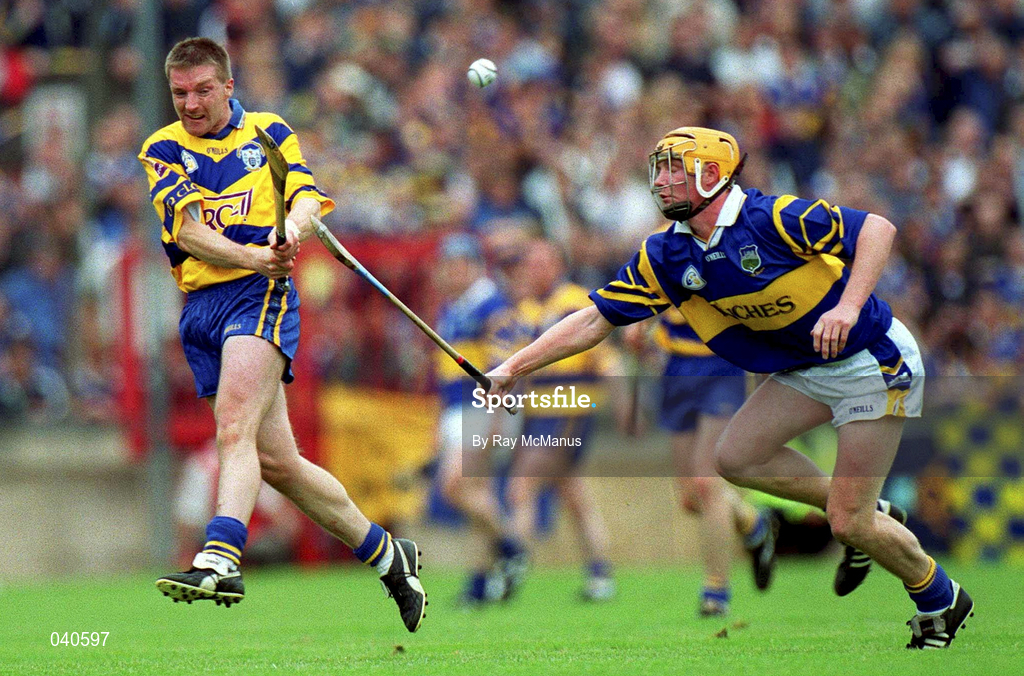 11 June 2000; Jamesie O'Connor of Clare in action against Eamonn Corcoran of Tipperary during the Guinness Munster Senior Hurling Championship Semi-Final match between Tipperary and Clare at Páirc Ui Chaoimh in Cork. Photo by Ray McManus/Sportsfile