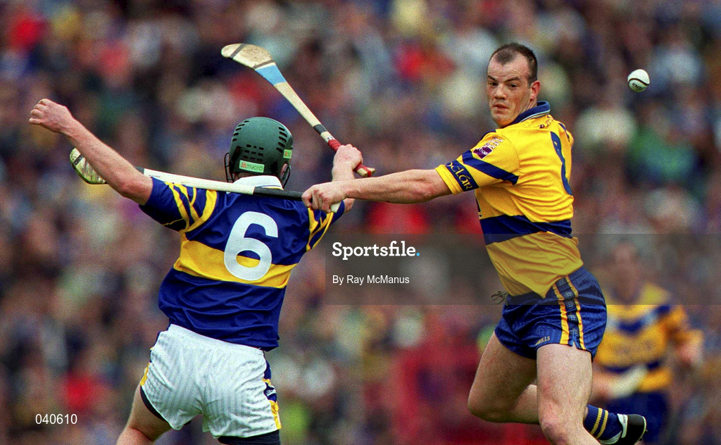 11 June 2000; Ollie Baker of Clare in action against David Kennedy of Tipperary during the Guinness Munster Senior Hurling Championship Semi-Final match between Tipperary and Clare at Páirc Ui Chaoimh in Cork. Photo by Ray McManus/Sportsfile