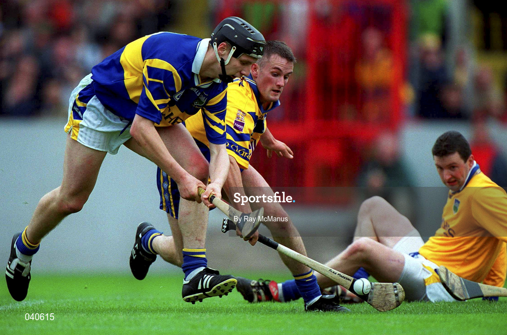 11 June 2000; Philip Maher of Tipperary in action against Alan Markham of Clare as Tipperary goalkeeper Brendan Cummins looks on during the Guinness Munster Senior Hurling Championship Semi-Final match between Tipperary and Clare at Páirc Ui Chaoimh in Cork. Photo by Ray McManus/Sportsfile