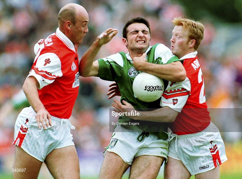25 June 2000; Stephen Maguire of Fermanagh in action against Gerard Reid, left, and Cathal Short of Armagh during the Bank of Ireland Ulster Senior Football Championship Semi-Final match between Armagh and Fermanagh at St Tiernach's Park in Clones, Monaghan. Photo by Damien Eagers/Sportsfile
