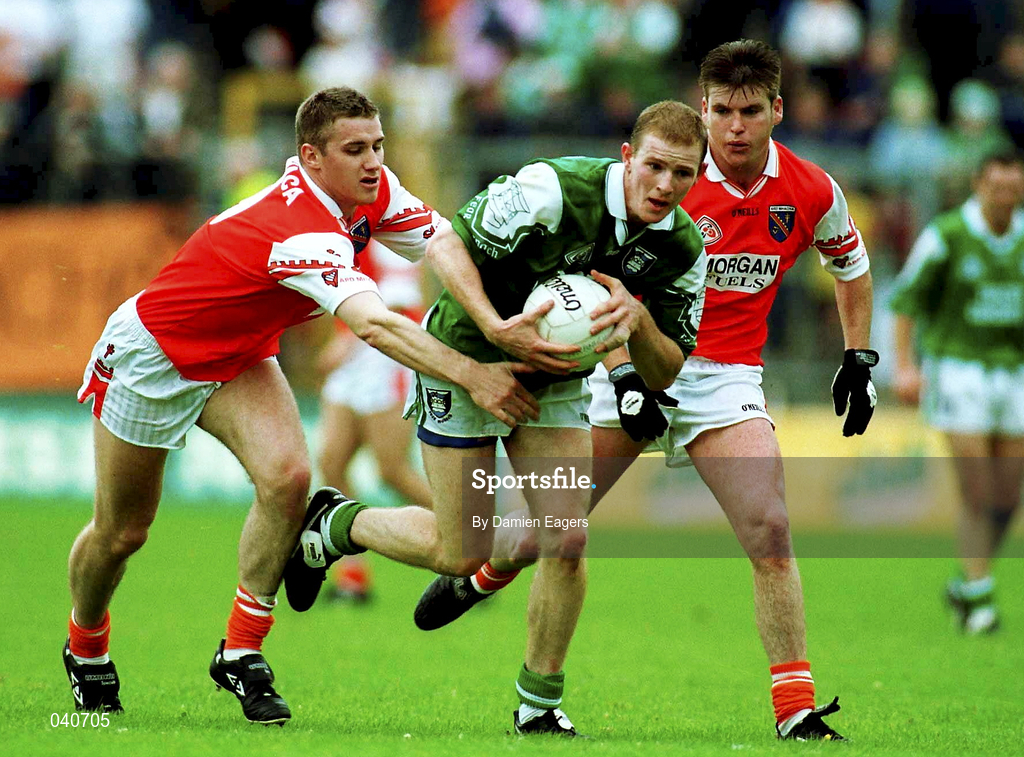 25 June 2000; Tom Brewster of Fermanagh in action against John McEntee, left, and Kieran Hughes of Armagh during the Bank of Ireland Ulster Senior Football Championship Semi-Final match between Armagh and Fermanagh at St Tiernach's Park in Clones, Monaghan. Photo by Damien Eagers/Sportsfile