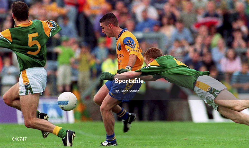 2 July 2000; Frankie Dolan of Roscommon in action against Colin Regan, left, and Michael McGuinness of Leitrim during the Bank of Ireland Connacht Senior Football Championship Semi-Final match between Roscommon and Leitrim in Dr. Hyde Park in Roscommon. Photo by David Maher/Sportsfile