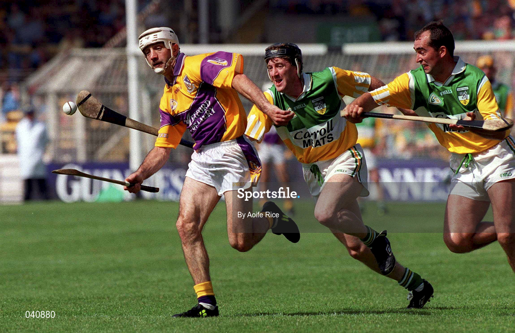18 June 2000; Martin Storey of Wexford in action against Brian Whelahan and Johnny Dooley of Offaly during the Guinness Leinster Senior Hurling Championship Semi-Final match between Offaly and Wexford at Croke Park in Dublin. Photo by Aoife Rice/Sportsfile