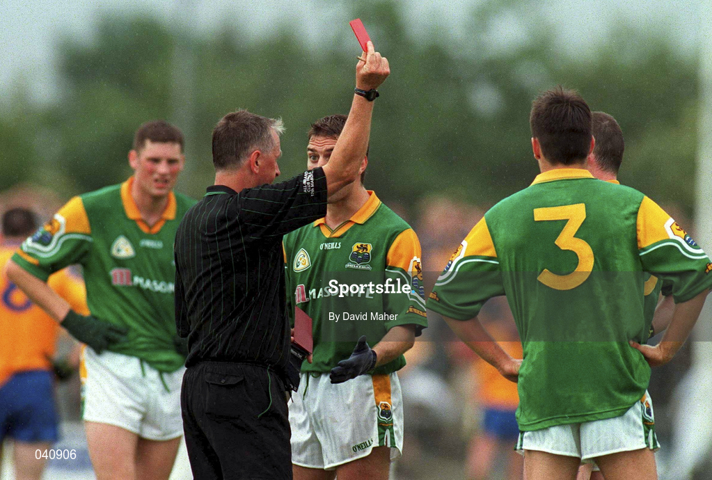 2 July 2000; Referee Niall Barrett shows the red card to Aidan Rooney of Leitrim, hidden behind No 3, during the Bank of Ireland Connacht Senior Football Championship Semi-Final match between Roscommon and Leitrim in Dr. Hyde Park in Roscommon. Photo by David Maher/Sportsfile
