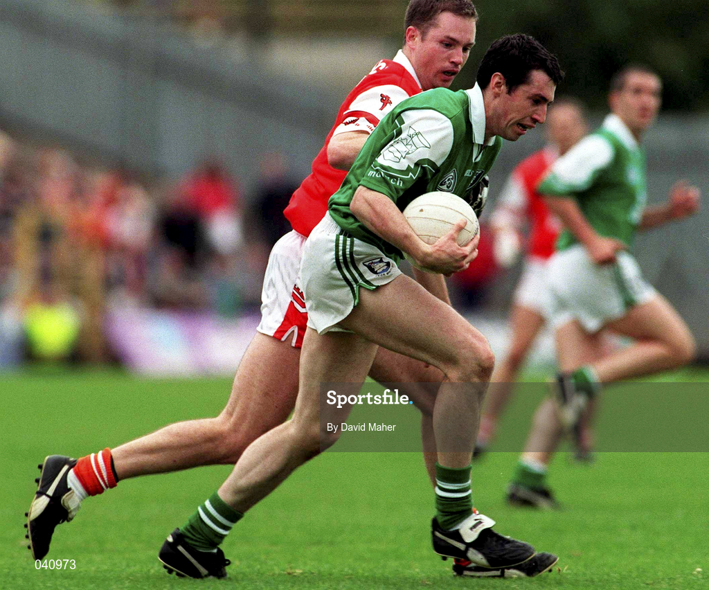 25 June 2000; Raymond Johnson of Fermanagh in action against Andrew McMann of Armagh during the Bank of Ireland Ulster Senior Football Championship Semi-Final match between Armagh and Fermanagh at St Tiernach's Park in Clones, Monaghan. Photo by David Maher/Sportsfile