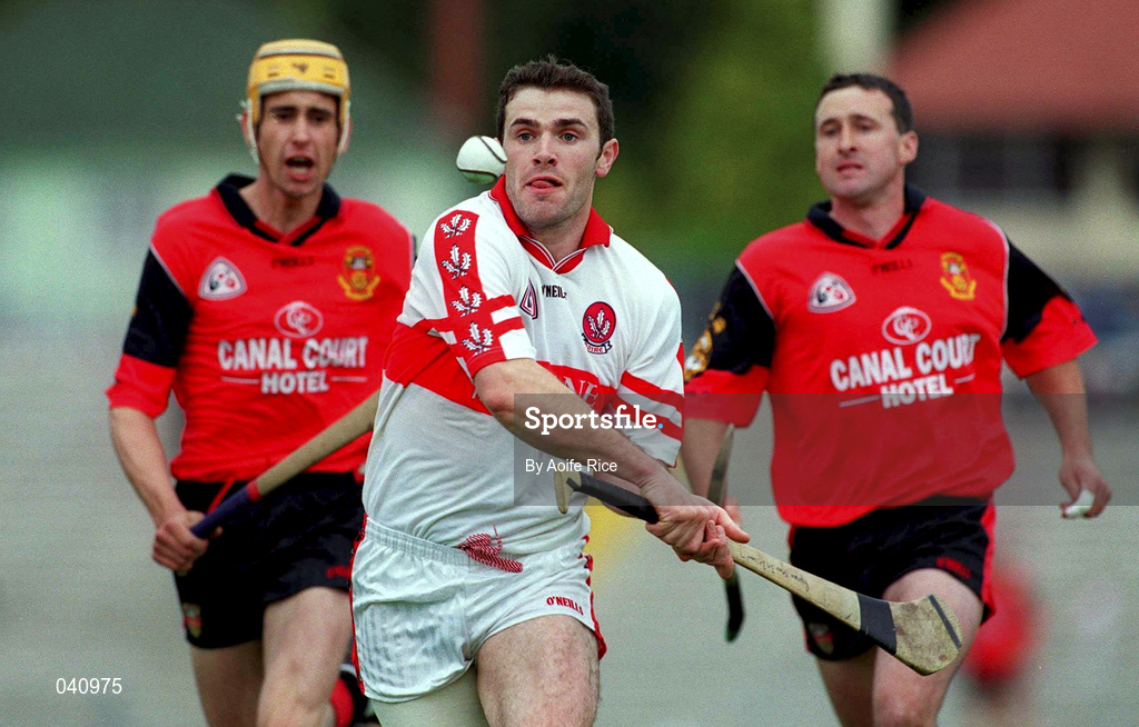 11 June 2000; Ronan McCloskey of Derry in action against John Caughey, left, and Donal Byers of Down during the Guinness Ulster Senior Hurling Championship Semi-Final between Derry and Down at Casement Park in Belfast, Antrim. Photo by Aoife Rice/Sportsfile