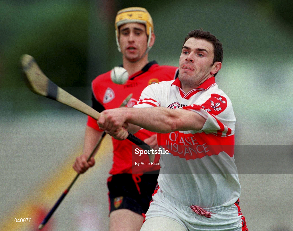 11 June 2000; Ronan McCloskey of Derry in action against John Caughey of Down during the Guinness Ulster Senior Hurling Championship Semi-Final between Derry and Down at Casement Park in Belfast, Antrim. Photo by Aoife Rice/Sportsfile