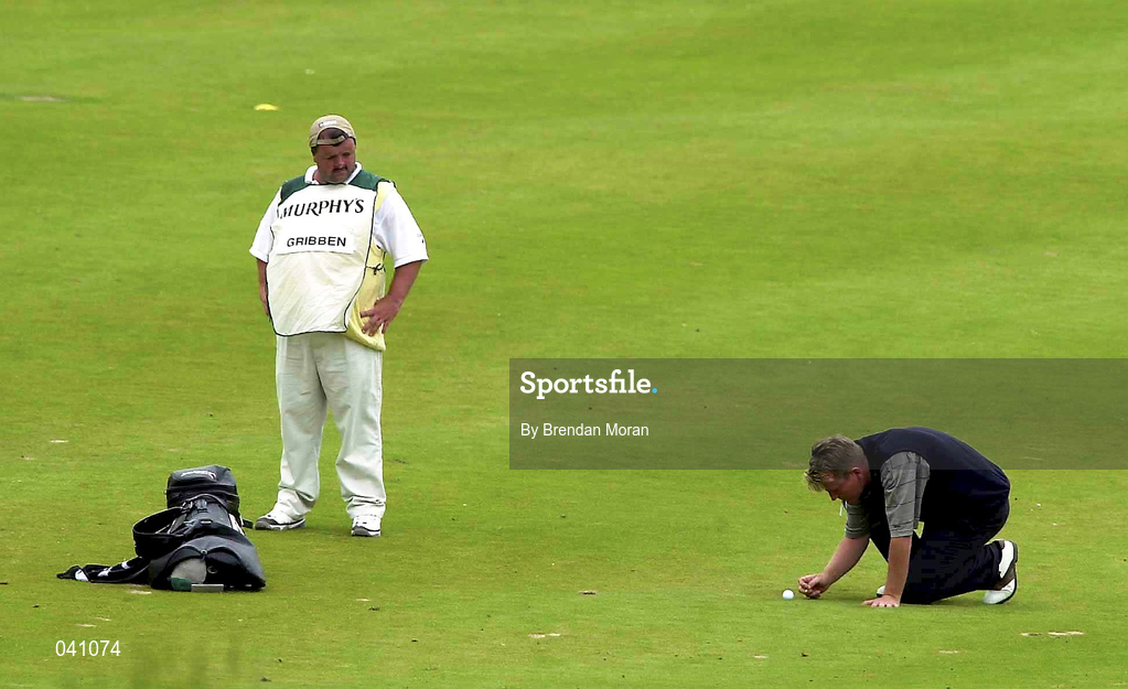 30 June 2000; Paddy Gribben of Ireland removes debris near his ball before taking his approach shot to the 13th green during the second day of the Murphy's Irish Open Golf Championship at Ballybunion Golf Club in Kerry. Photo by Brendan Moran/Sportsfile