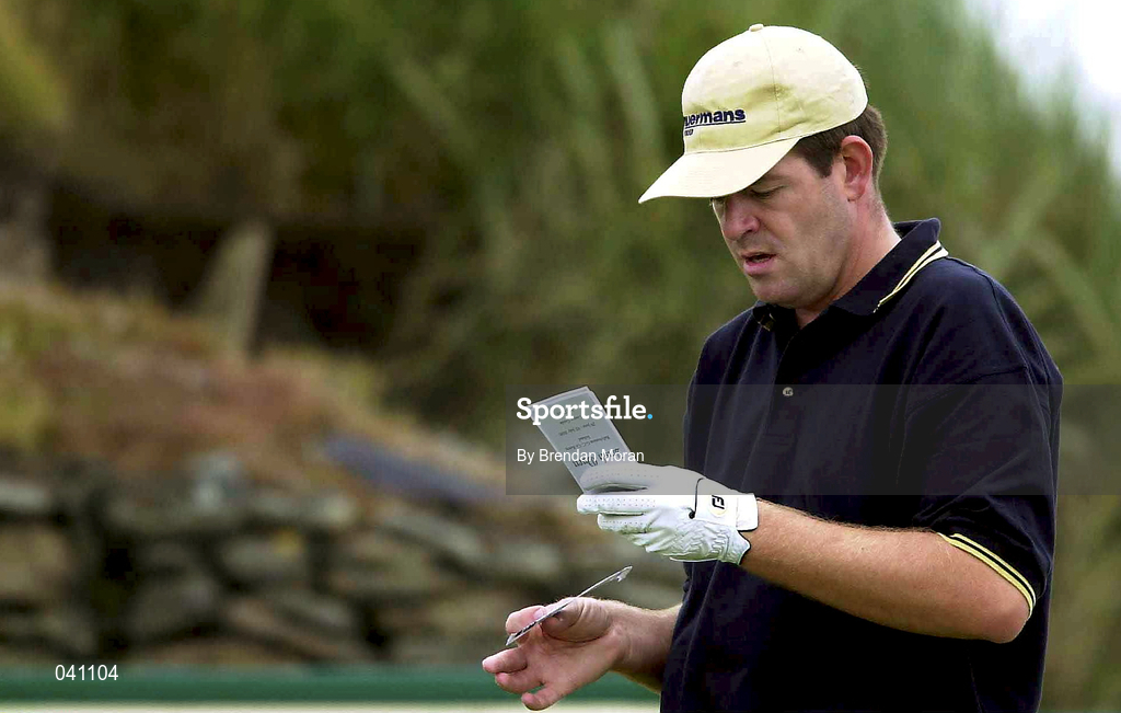 30 June 2000; Rolf Muntz of the Netherlands checks the yardage on the card at the 12th tee box during the second day of the Murphy's Irish Open Golf Championship at Ballybunion Golf Club in Kerry. Photo by Brendan Moran/Sportsfile