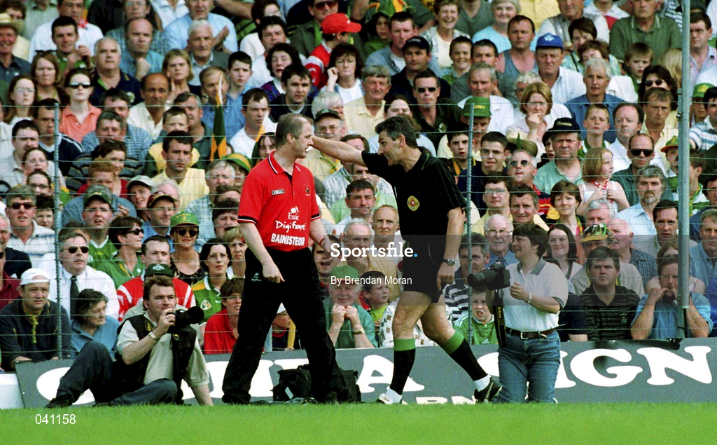 18 June 2000; Cork manager Larry Tompkins is ordered to sit on the bench by referee Mick Curley during the Bank of Ireland Munster Senior Football Championship Semi-Final match between Kerry and Cork at Fitzgerald Stadium in Killarney, Kerry. Photo by Brendan Moran/Sportsfile