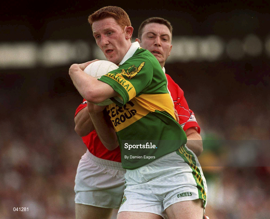 18 June 2000; Noel Kennelly of Kerry is tackled by Joe Kavanagh of Cork during the Bank of Ireland Munster Senior Football Championship Semi-Final match between Kerry and Cork at Fitzgerald Stadium in Killarney, Kerry. Photo by Damien Eagers/Sportsfile