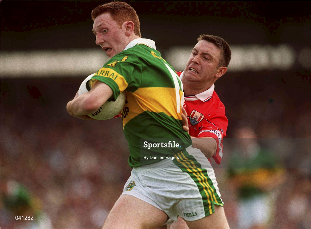 18 June 2000; Noel Kennelly of Kerry is tackled by Joe Kavanagh of Cork during the Bank of Ireland Munster Senior Football Championship Semi-Final match between Kerry and Cork at Fitzgerald Stadium in Killarney, Kerry. Photo by Damien Eagers/Sportsfile