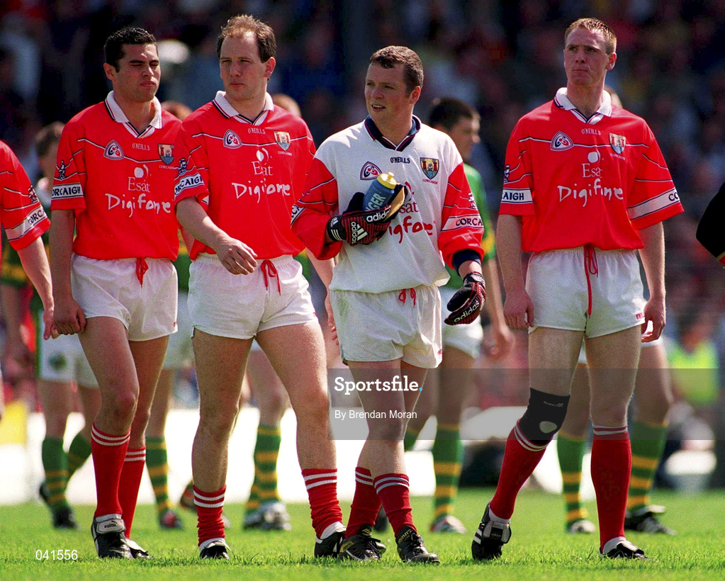 18 June 2000; Cork captain Philip Clifford, right, leads his team in the pre-match parade prior to the Bank of Ireland Munster Senior Football Championship Semi-Final match between Kerry and Cork at Fitzgerald Stadium in Killarney, Kerry. Photo by Brendan Moran/Sportsfile
