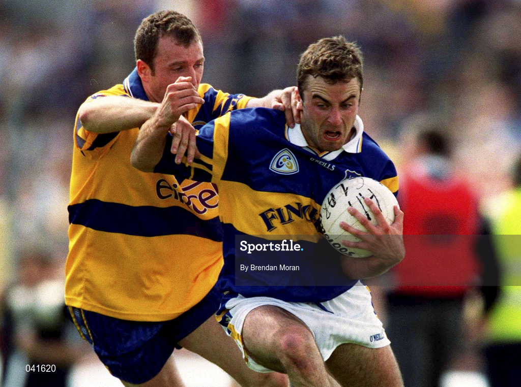 25 June 2000; Damien Byrne of Tipperary in action against Martin Daly of Clare during the Bank of Ireland Munster Senior Football Championship Semi-Final match between Clare and Tipperary at the Gaelic Grounds in Limerick. Photo by Brendan Moran/Sportsfile