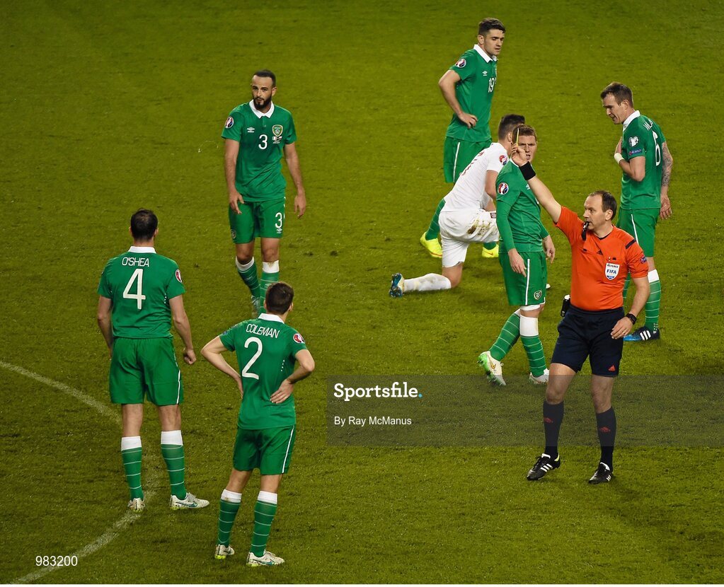 29 March 2015; Referee Jonas Eriksson shows a yellow card to John O'Shea, Republic of Ireland. UEFA EURO 2016 Championship Qualifier, Group D, Republic of Ireland v Poland. Aviva Stadium, Lansdowne Road, Dublin. Picture credit: Ray McManus / SPORTSFILE