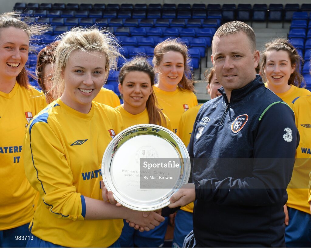 11 April 2015; WIT captain Edel Maher is presented with the shield by Mark Scanlon from the FAI. WSCAI Intervarsities Shield Final, Waterford Institute of Technology v University of Limerick, Plate Final, Waterford IT, Waterford. Picture credit: Matt Browne / SPORTSFILE