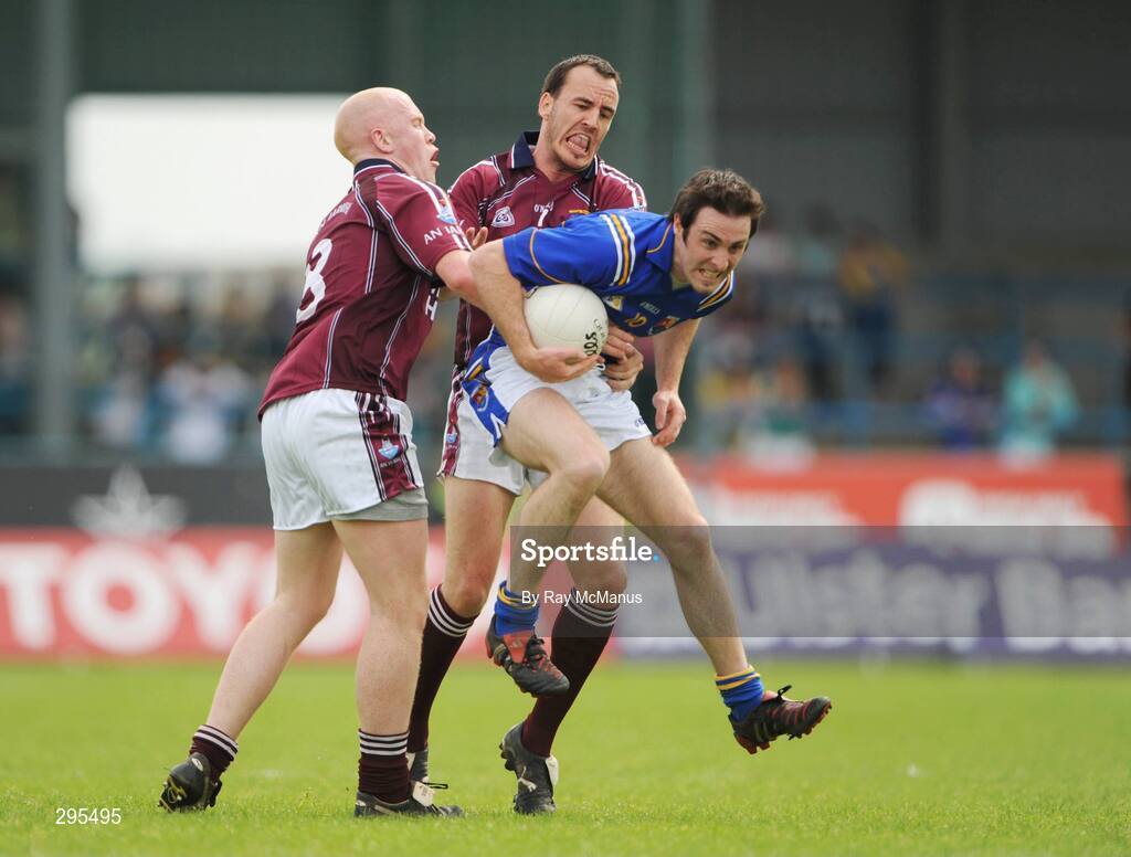 11 May 2008; Kevin Mulligan, Longford, is tackled by Donal O'Donoghue, 8, and Damien Healy, Westmeath. GAA Football Leinster Senior Championship, Longford v Westmeath, Pearse Park, Longford. Picture credit: Ray McManus / SPORTSFILE