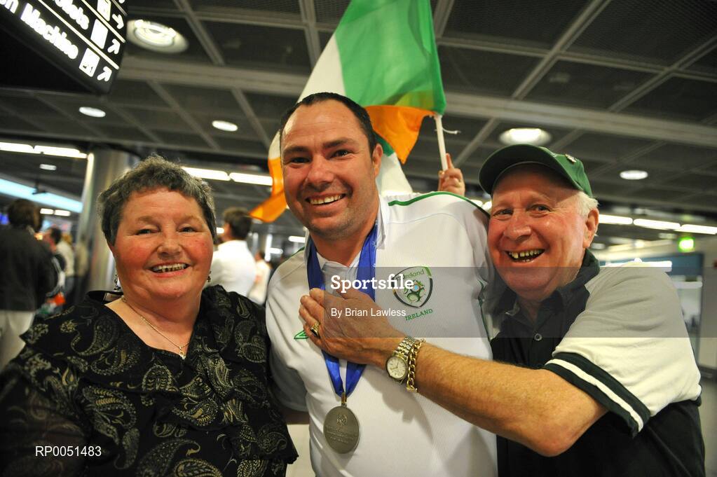 8 May 2008; William O'Brien, Team Ireland, with his mother Kathleen and father Patrick on arrival in Dublin Airport. TEAM Ireland returned from the Special Olympics European Football Tournament which took place in Switzerland as competition runners up having lost out to Latvia in the finals by one goal.  24 countries in total took part in the tournament to celebrate European Football Week, supported by UEFA. Dublin Airport. Picture credit: Brian Lawless / SPORTSFILE