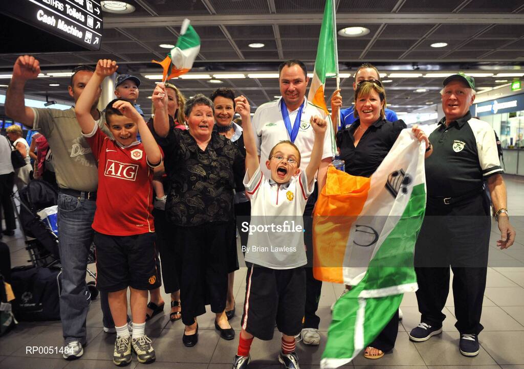 8 May 2008; William O'Brien, Team Ireland, celebrates with his family on arrival in Dublin Airport. TEAM Ireland returned from the Special Olympics European Football Tournament which took place in Switzerland as competition runners up having lost out to Latvia in the finals by one goal.  24 countries in total took part in the tournament to celebrate European Football Week, supported by UEFA. Dublin Airport. Picture credit: Brian Lawless / SPORTSFILE