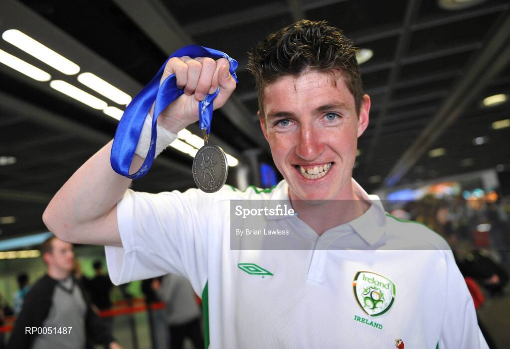 8 May 2008; Team Ireland player Brendan O'Reilly shows his medal on arrival in Dublin Airport. TEAM Ireland returned from the Special Olympics European Football Tournament which took place in Switzerland as competition runners up having lost out to Latvia in the finals by one goal.  24 countries in total took part in the tournament to celebrate European Football Week, supported by UEFA. Dublin Airport. Picture credit: Brian Lawless / SPORTSFILE