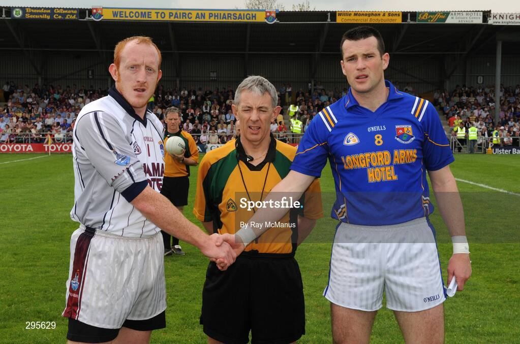 11 May 2008; The Westmeath captain Gary Connaughton, left, shakes hands, accross referee Michael Hughes, with Longford captain Liam Keenan. GAA Football Leinster Senior Championship, Longford v Westmeath, Pearse Park, Longford. Picture credit: Ray McManus / SPORTSFILE