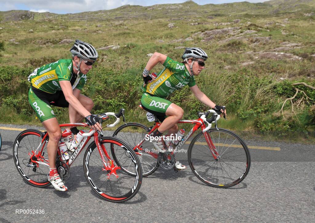 22 May 2008; Stephen Gallagher, left, and Paidi O'Brien, An Post sponsored Sean Kelly team, take water bottles on board during the race. FBD Insurance Ras 2008 - Stage 5, Tralee - Skibbereen. Picture credit: Stephen McCarthy / SPORTSFILE