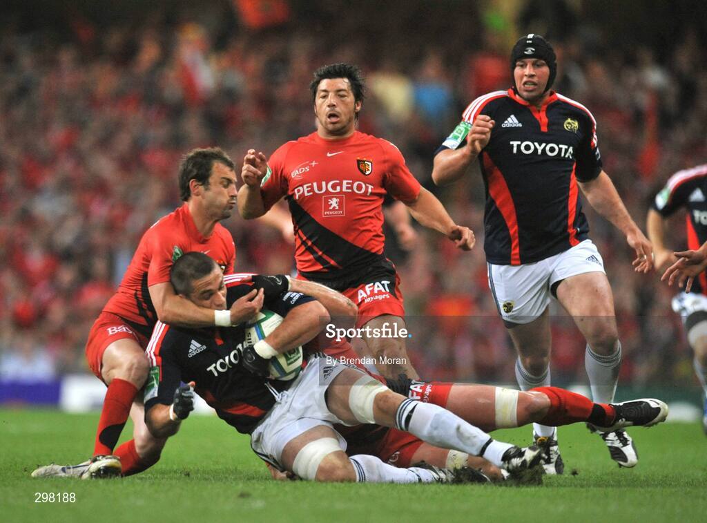 24 May 2008; Alan Quinlan, Munster, is tackled by Jean Baptiste Ellisalde, left, and Shaun Sowerby, Toulouse. Heineken Cup Final, Munster v Toulouse, Millennium Stadium, Cardiff, Wales. Picture credit: Brendan Moran / SPORTSFILE