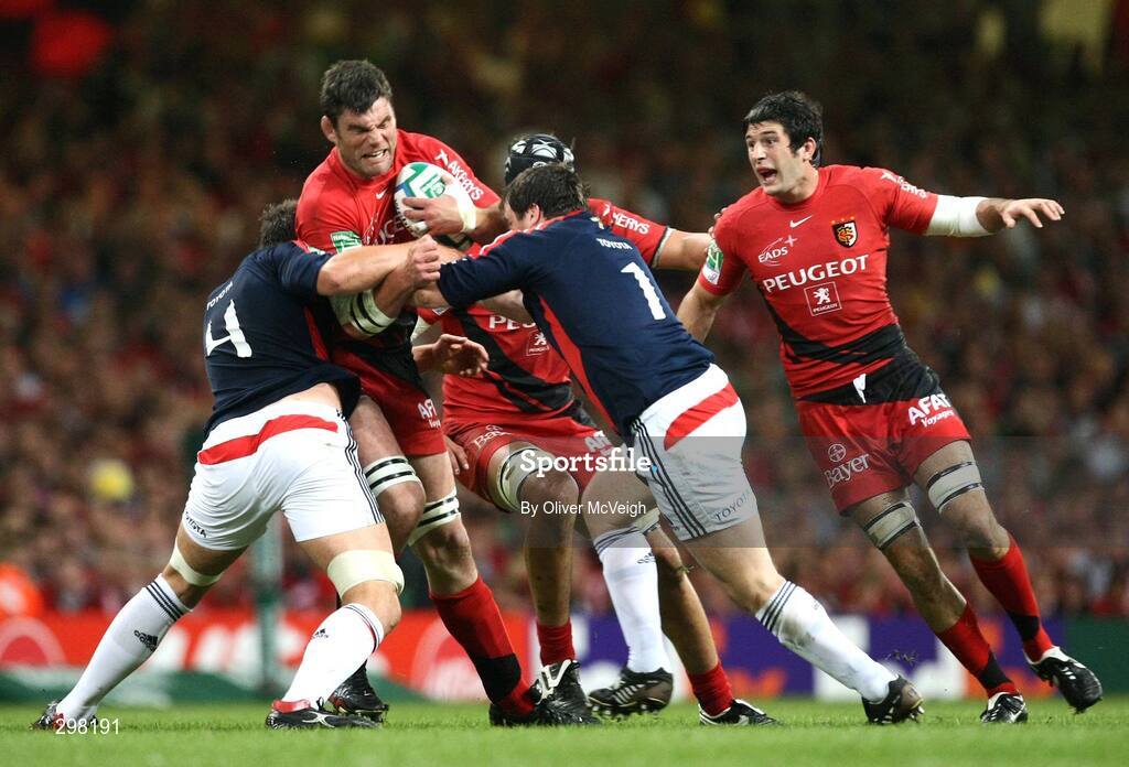 24 May 2008; Jean Bouilhou, Toulouse, is tackled by Donncha O'Callaghan and Marcus Horan, Munster. Heineken Cup Final, Munster v Toulouse, Millennium Stadium, Cardiff, Wales. Picture credit: Oliver McVeigh / SPORTSFILE