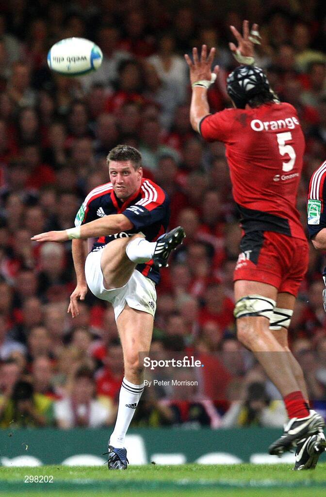 24 May 2008; Munster's Ronan O'Gara gets his kick away despite the attempts of Toulouse's Patricio Albacete. Heineken Cup Final, Munster v Toulouse, Millennium Stadium, Cardiff, Wales. Picture credit: Peter Morrison / SPORTSFILE