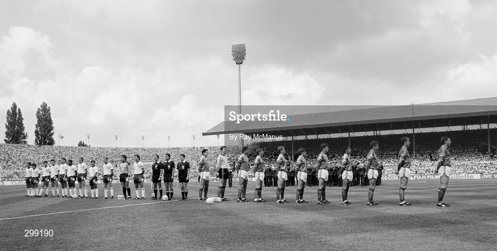 12 June 1988; The two teams and match officials stand for the National Anthems. Republic of Ireland, from right to left, Tony Galvin, Mick McCarthy, Kevin Moran, Chris Hughton, John Aldridge, Ray Houghton, Chris Morris, Ronnie Whelan, Paul McGrath, Packie Bonner and captain Frank Stapleton. Centre, from right to left, linesman Klaus Peschel, referee Siegfried Kirschen and linesman Manfred Rossner, all from East Germany. England, from right to left, captain Bryan Robson, Peter Shilton, Gary Stevens, Kenny Samson, Mark Wright, John Barnes, Tony Adams, Chris Waddle, Neil Webb, Peter Beardsley and Gary Lineker prior to the UEFA European Football Championship Finals Group B match between England and Republic of Ireland at Neckarstadion in Stuttgart, Germany. Photo by Ray McManus/Sportsfile