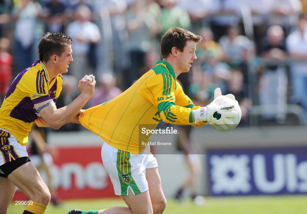 1 June 2008; Michael Ahern, Meath, is tackled by Adrian Flynn, Wexford. GAA Football Leinster Senior Championship Quarter-Final, Meath v Wexford, Dr. Cullen Park, Carlow. Picture credit: Matt Browne / SPORTSFILE