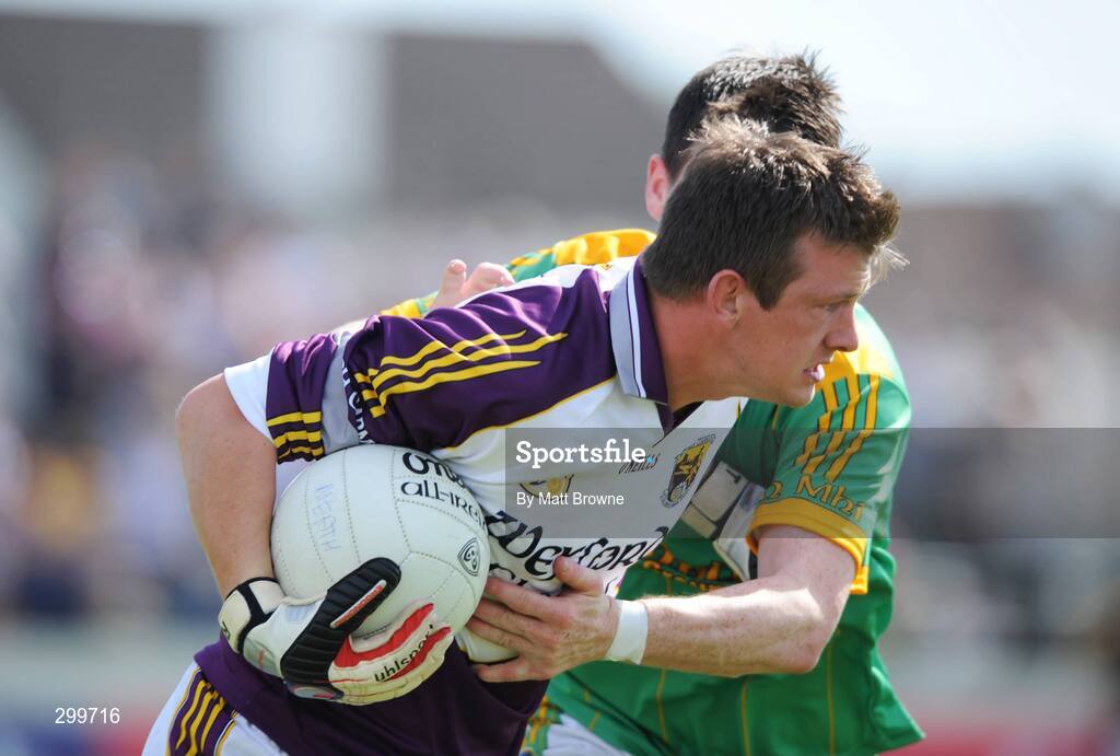 1 June 2008; Anthony Masterson, Wexford, is tackled by Peadar Byrne, Meath. GAA Football Leinster Senior Championship Quarter-Final, Meath v Wexford, Dr. Cullen Park, Carlow. Picture credit: Matt Browne / SPORTSFILE