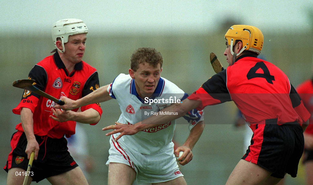 3 June 2000; Kevin Kennedy of New York in action against Down players, John Caughey, right, and Gary Gordan, during the Guinness Ulster Senior Hurling Championship Quarter-Final between Down and New York at Casement Park in Belfast. Photo by Ray McManus/Sportsfile