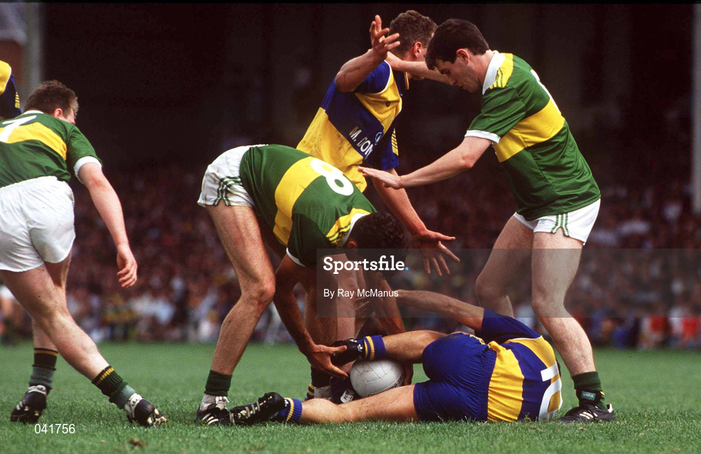19 July 1992; Noel Roche, 10, and Tom Morrissey of Clare in action against Noel O'Mahony, 8, and Anthony Glesson of Kerry during the Munster Senior Football Championship Final match between Clare and Kerry at the Gaelic Grounds in Limerick. Photo by Ray McManus/Sportsfile