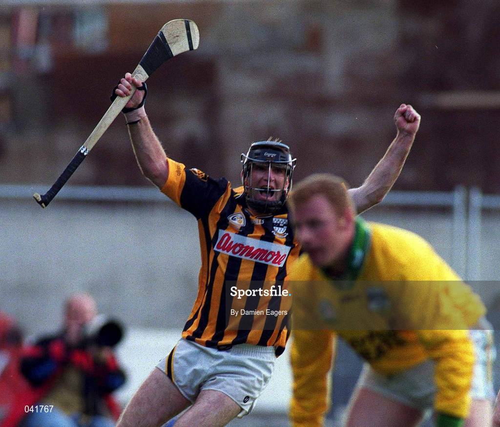 9 July 2000; DJ Carey of Kilkenny celebrates after scoring a goal for his side as Stephen Byrne of Offaly looks on during the Guinness Leinster Senior Hurling Championship Final match between Kilkenny and Offaly at Croke Park in Dublin. Photo by Damien Eagers/Sportsfile