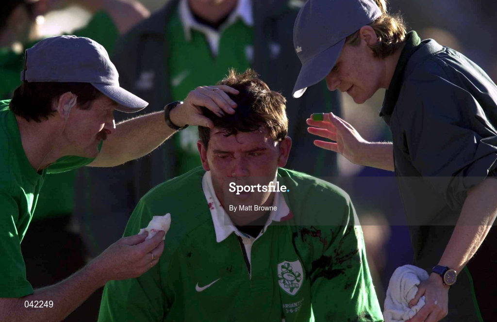 3 June 2000; Shane Horgan of Ireland receives treatment for a head wound from Irish Rugby Dr. Michael Griffin, and physiotherapist Denise Fanagan during the Rugby International match between Argentina and Ireland at Club Atletico Ferrocarril Oeste in Buenos Aires, Argentina. Photo by Matt Browne/Sportsfile